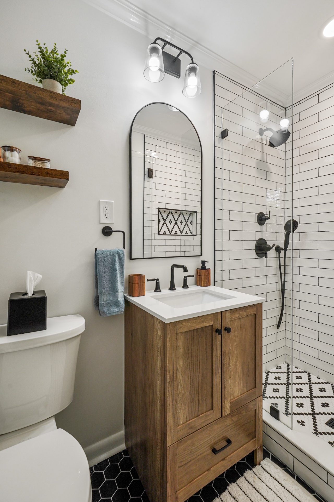 Complete bathroom with wood vanity